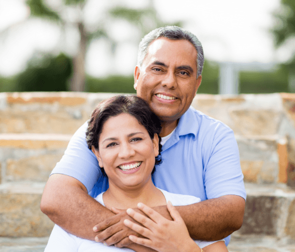 Man and woman smiling outdoors