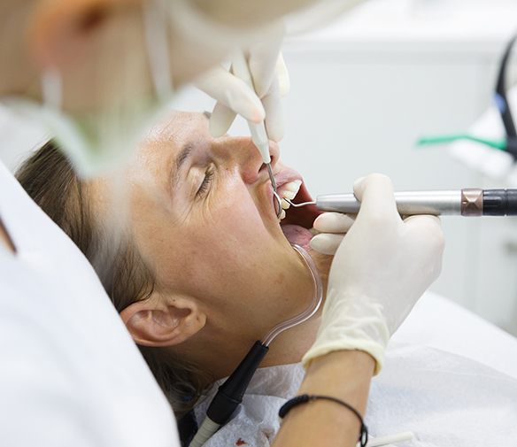 Man receiving scaling and root planing periodontal therapy