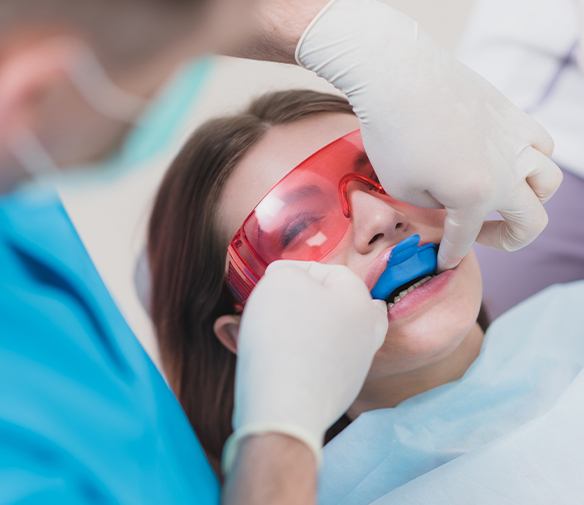 Woman receiving fluoride treatment