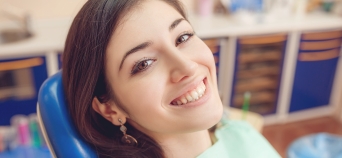 Woman smiling during preventive dentistry checkup