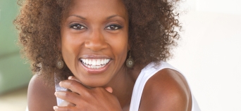 Woman smiling after cosmetic dentistry treatment