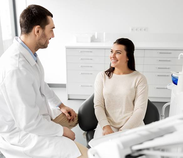 Cosmetic dentist and patient talking during initial consultation